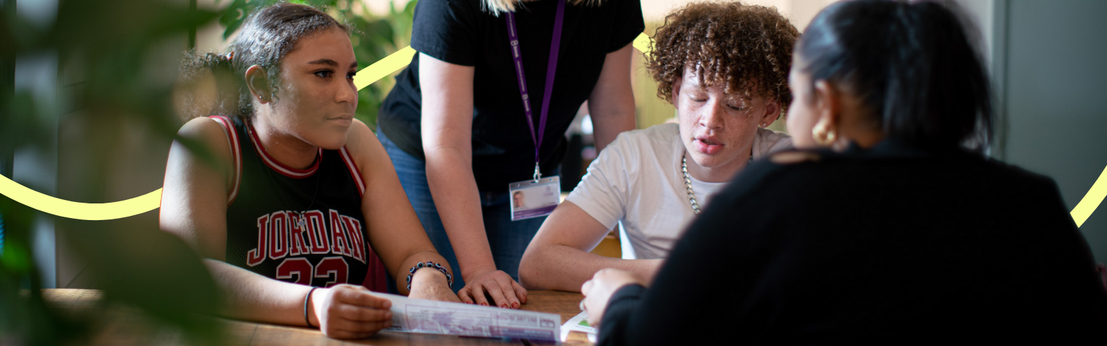 Three young people in a lesson